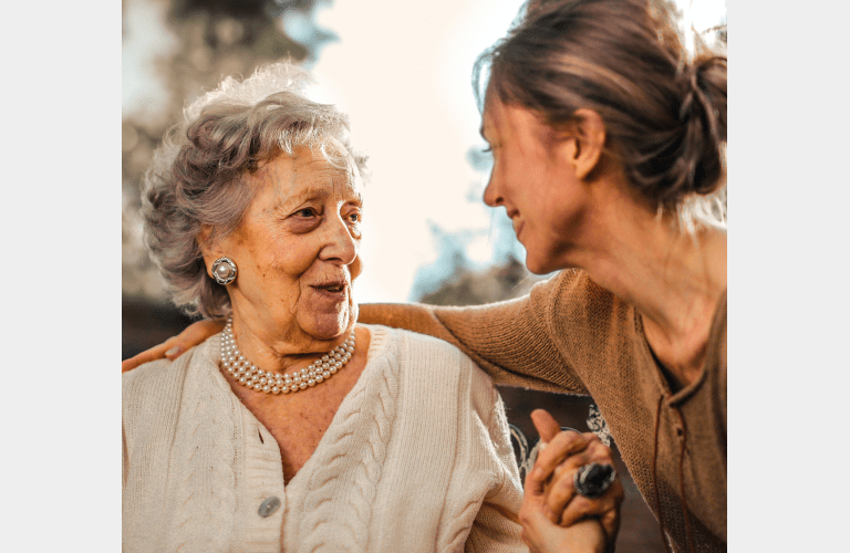elderly person talking to her daughter in a KYN Care Home